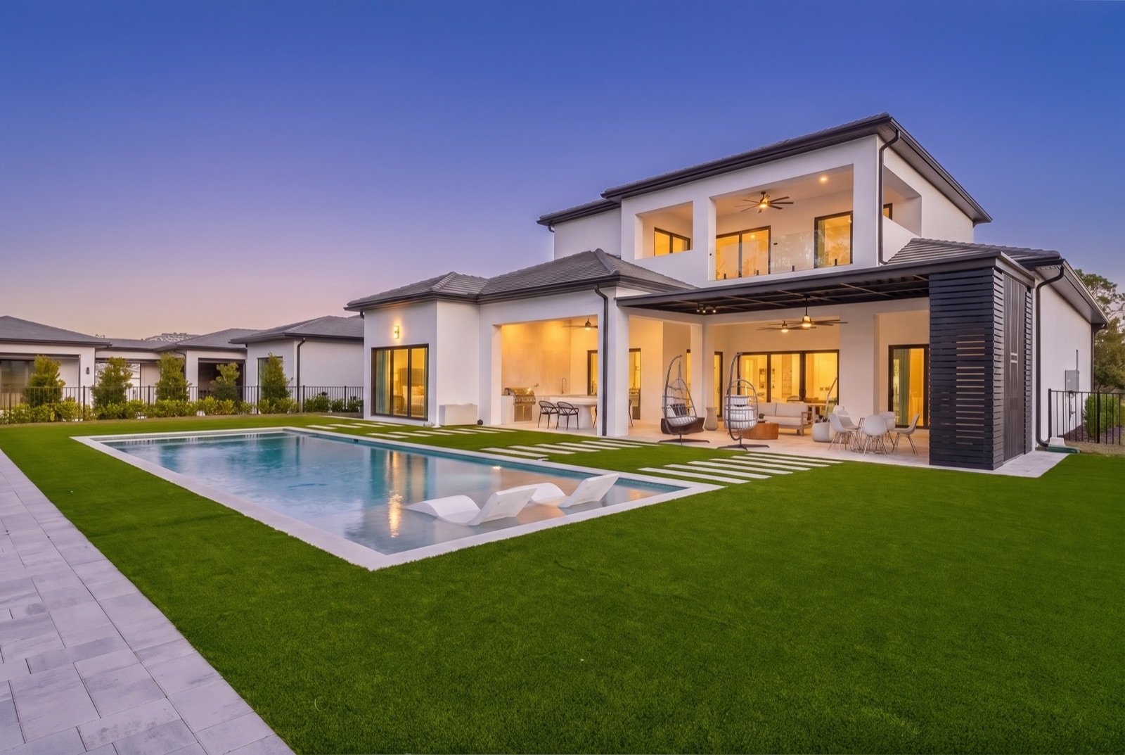 Backyard pool and patio at twilight, Virtual Dusk